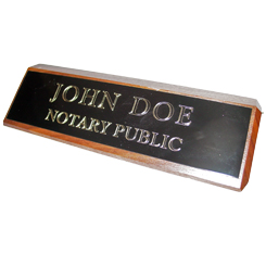 This elegant, genuine Indiana notary walnut desk, sign is made of solid wood and engraved on a metal plate with gold lettering with your notary name and the wording 'Notary Public'. It makes a fine addition to any desk or office. This sign can be customized with up to two lines.
